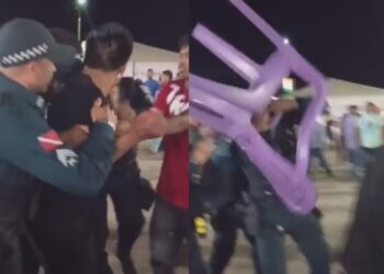 Homem arremessa cadeira contra policiais durante show de Amado Batista. — Foto: Reprodução / Redes sociais